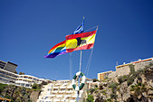 Spanish and EU flags flying on the beach at Torremolinos, Costa del Sol, Spain